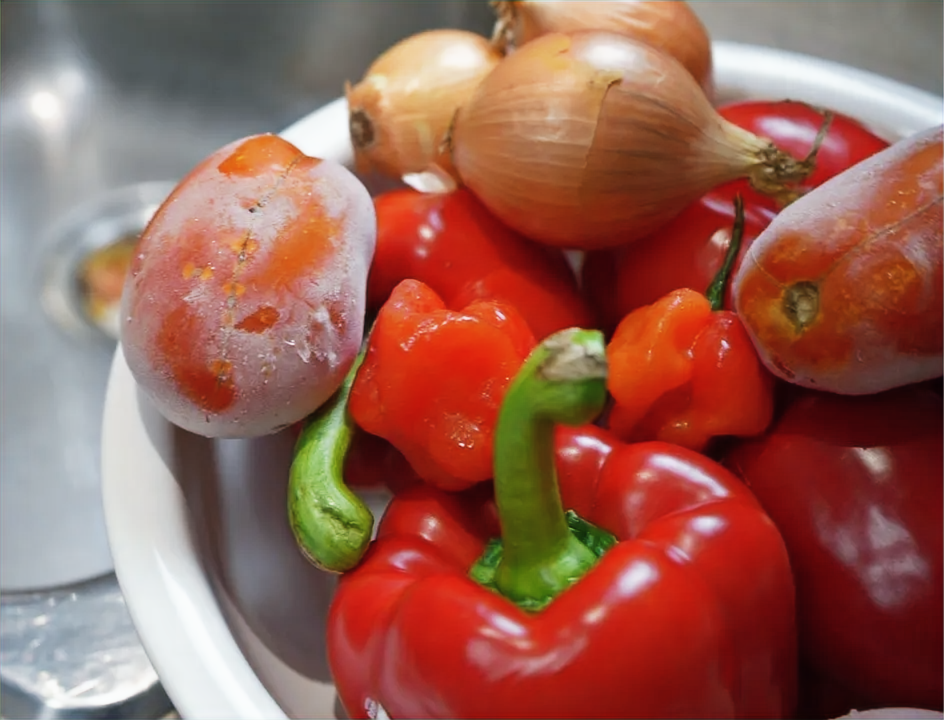 red bell peppers, tomatoes, onions, scotch bonnets to make West African red stew