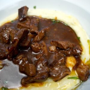 beef in gravy served on mashed potatoes