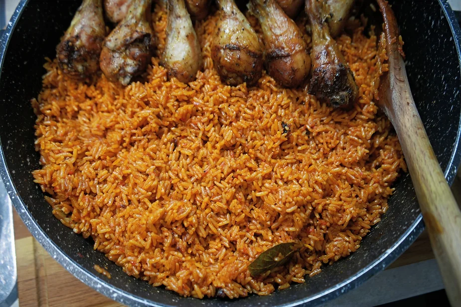 nigerian jollof rice served with fried chicken drumsticks