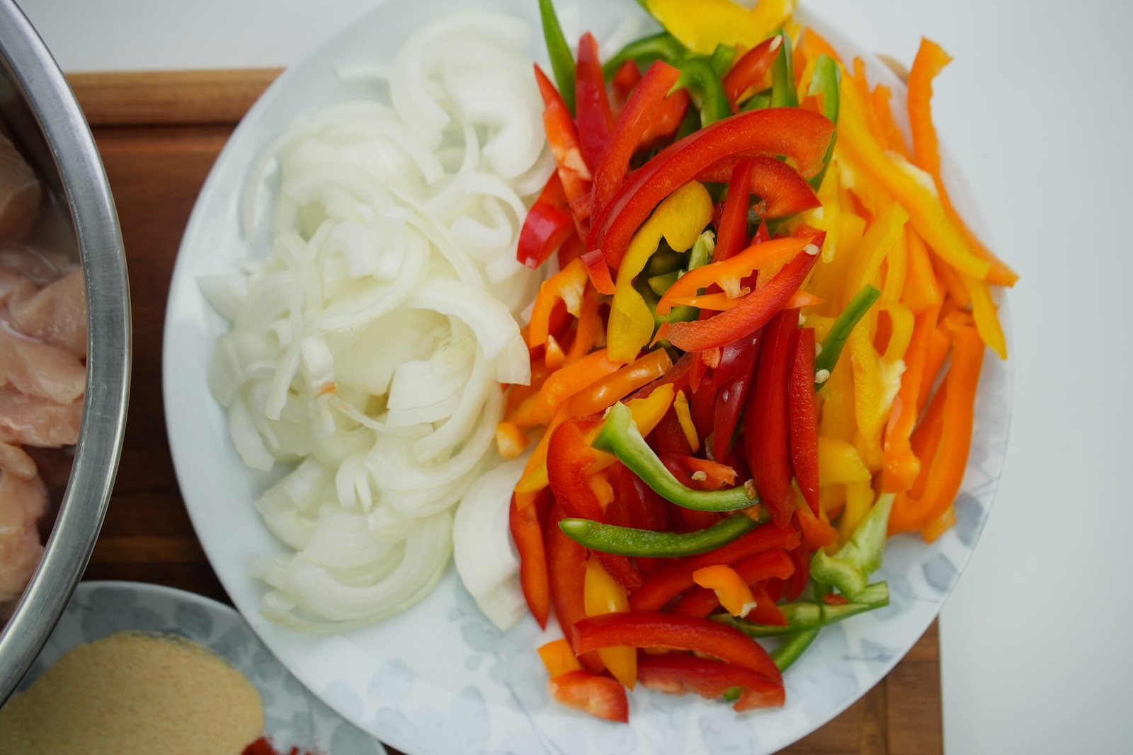 sliced onions and thinly sliced bell peppers