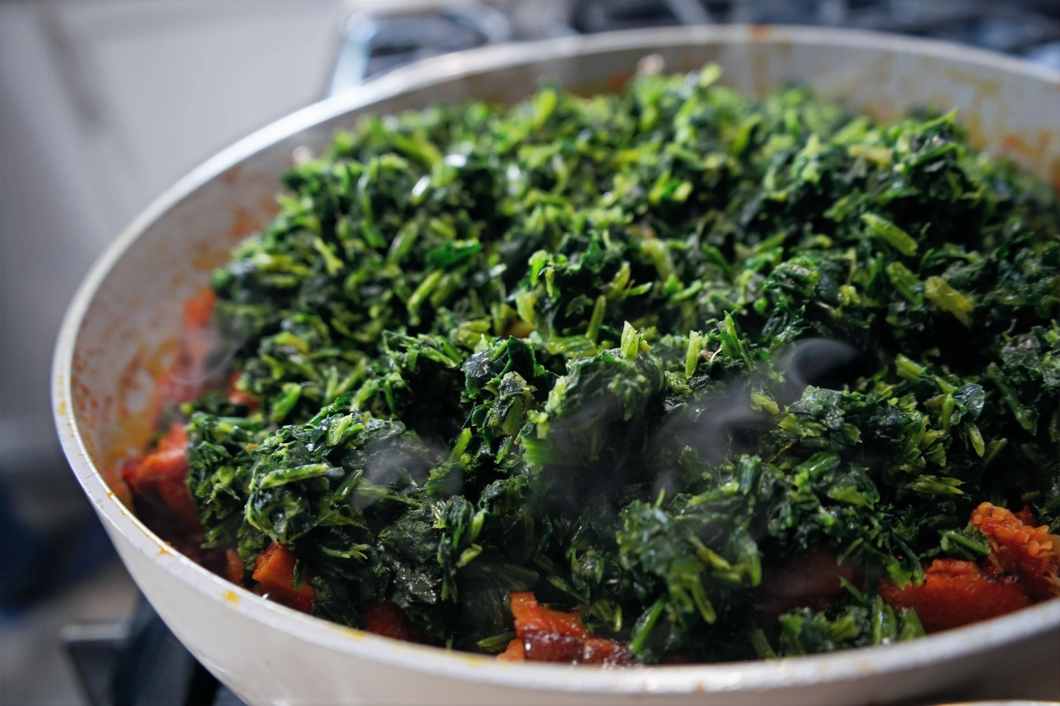 spinach in pot of stew