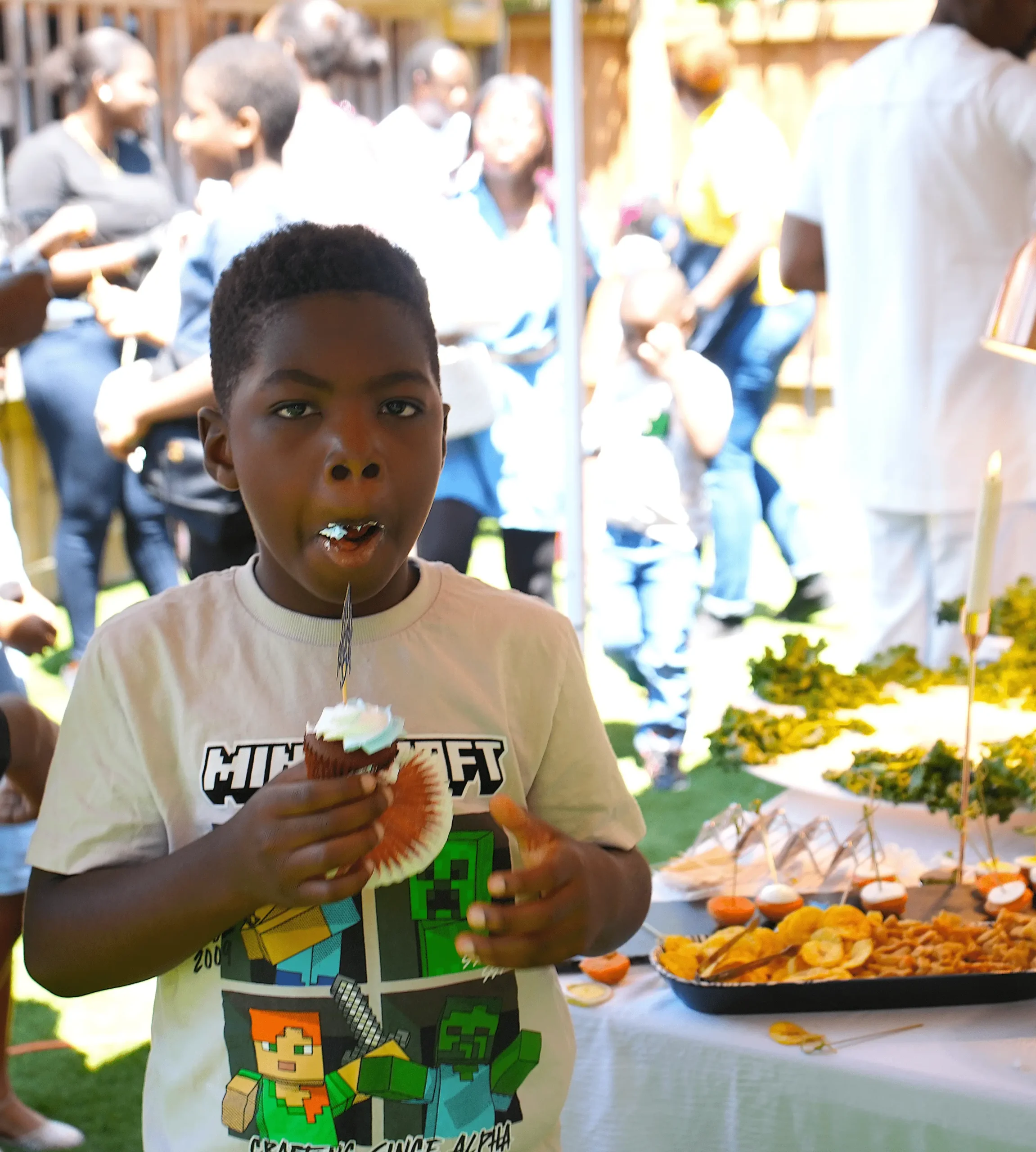 a child eating cupcake at an event catered by food sturvs